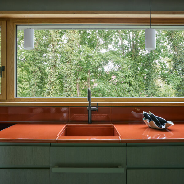 Custom Terracotta glazed lava worktop and splashback by Pyrolave for a contemporary private residence in Germany. Design by Carlo Design Studio. Photo © Jordana Schramm.